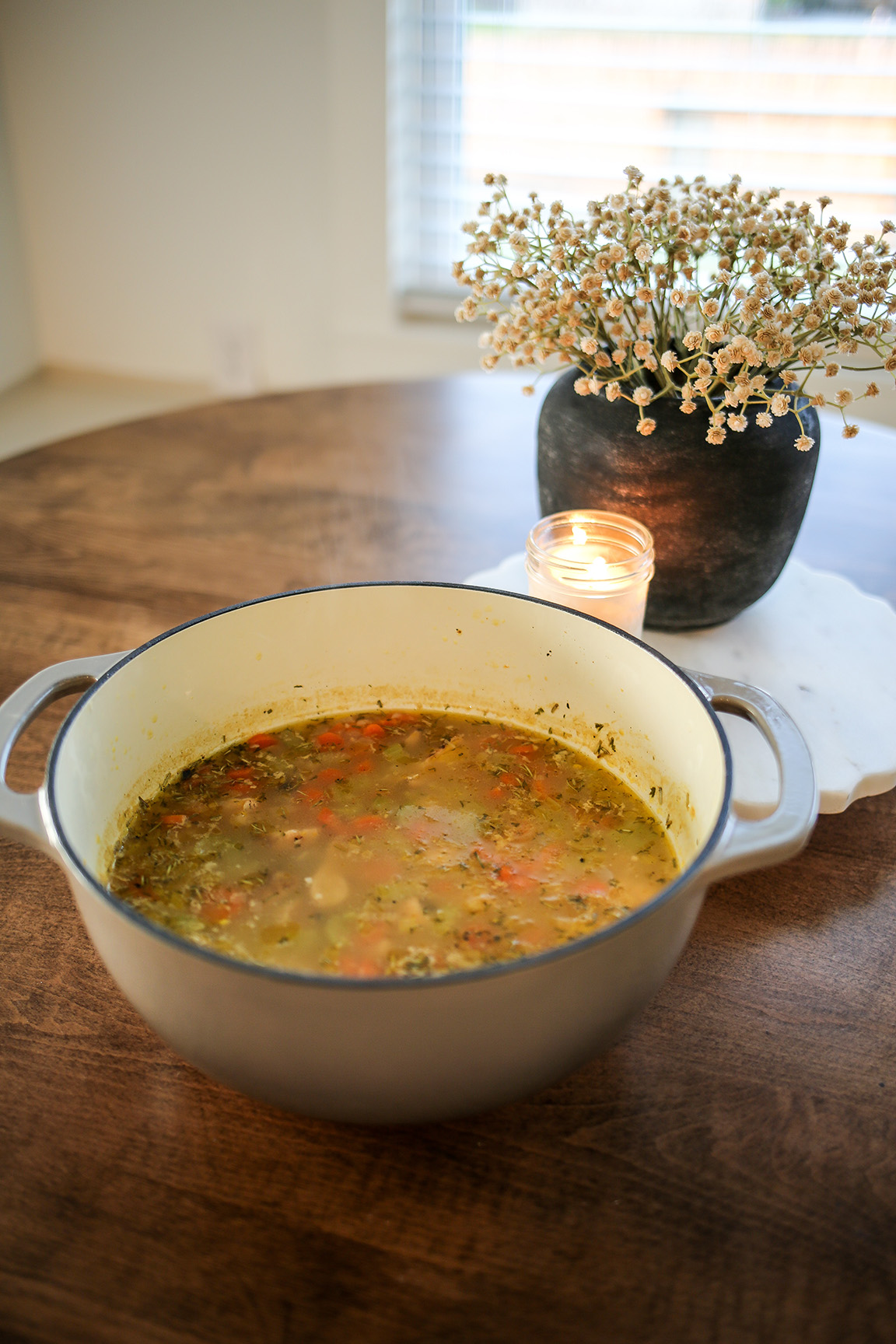 lemon chicken orzo soup in a dutch oven